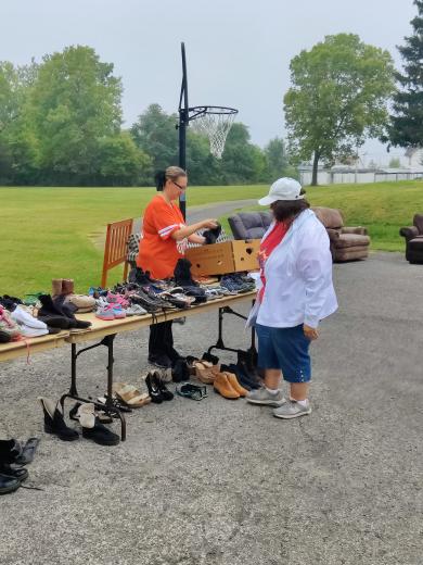 two people setting shoes on a table