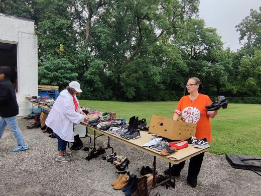 two people setting shoes on a table