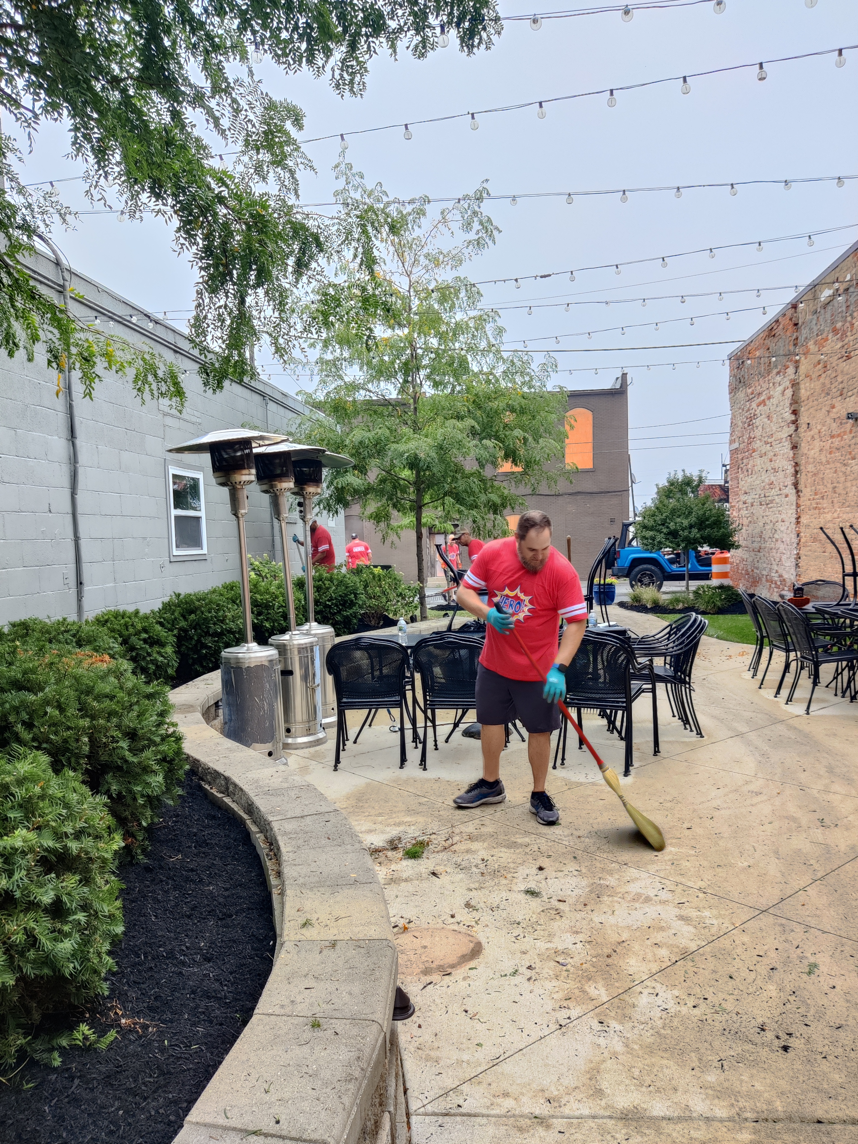 Man sweeping patio