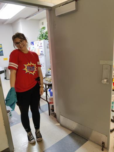 women in red shirt posing for a picture