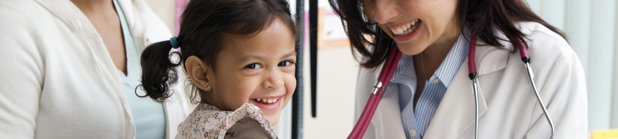 little girl with female doctor