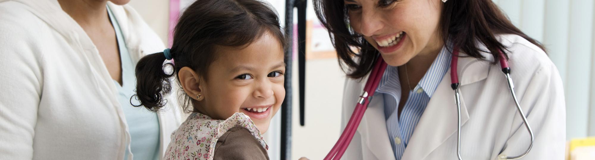 little girl with female doctor